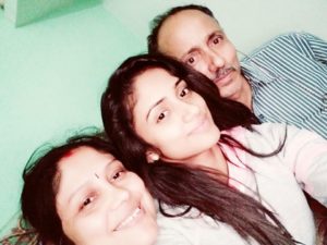 Nisha Guragain with her parents