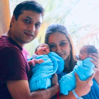 Priya Balan with her husband and children