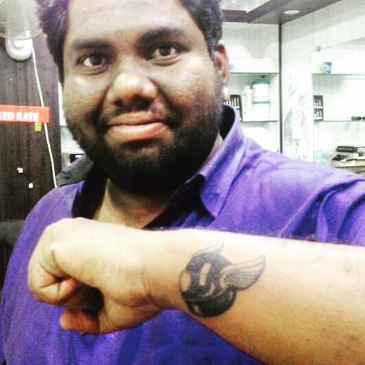 Harsha Chemudu a riding tattoo