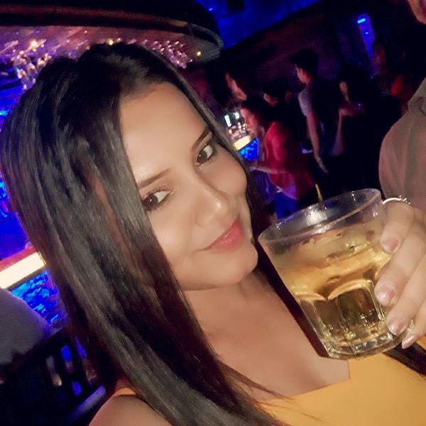 Priya Gamre with the glass of alcoho