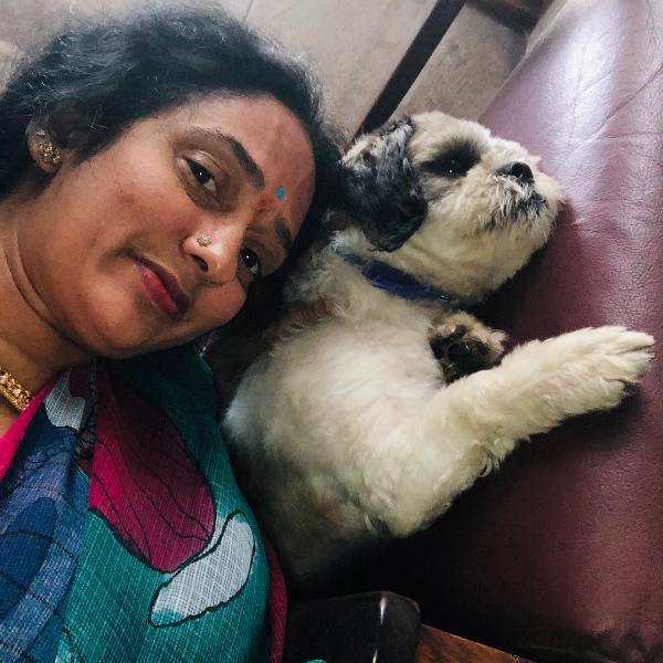  Shyamala Devi with her pet dog 