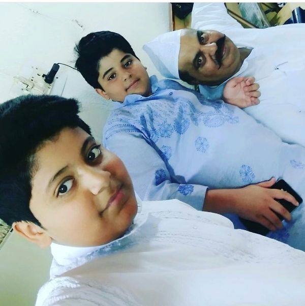 Asad Ahmed with his father and brother 