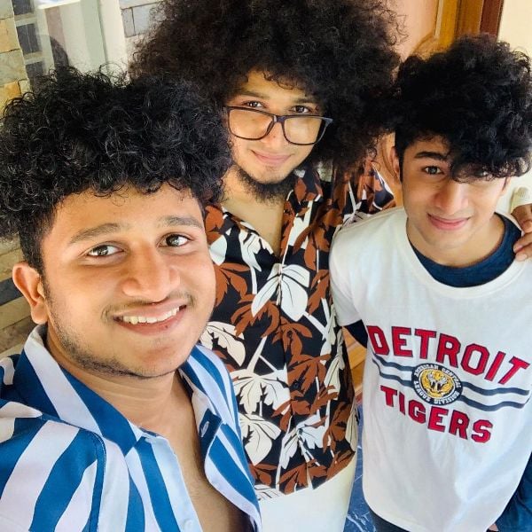 Rishi S Kumar (center) with his brothers